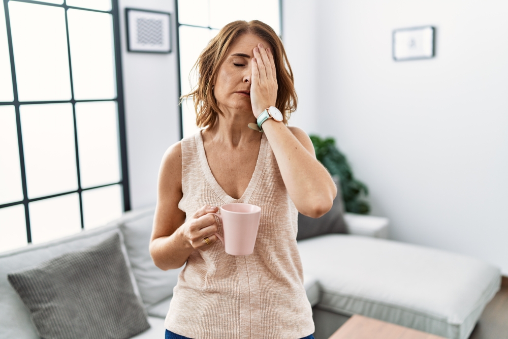 Woman tired with cup of coffee