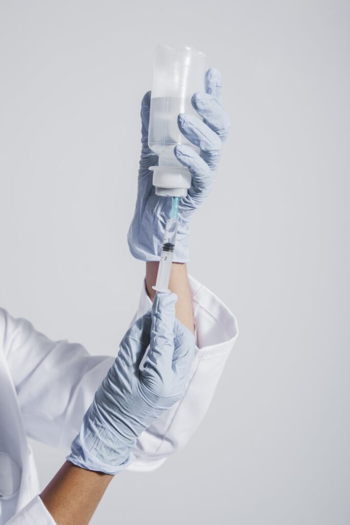 hands with gloves vaccine